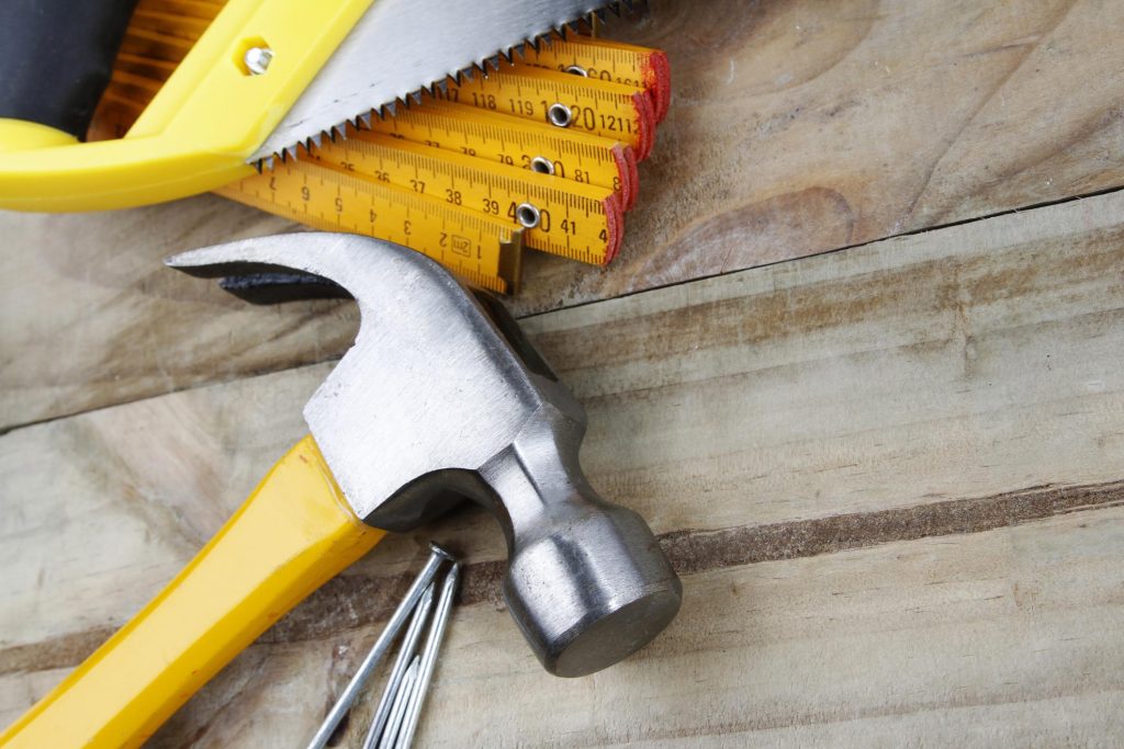 hammer, nails, saw and measures