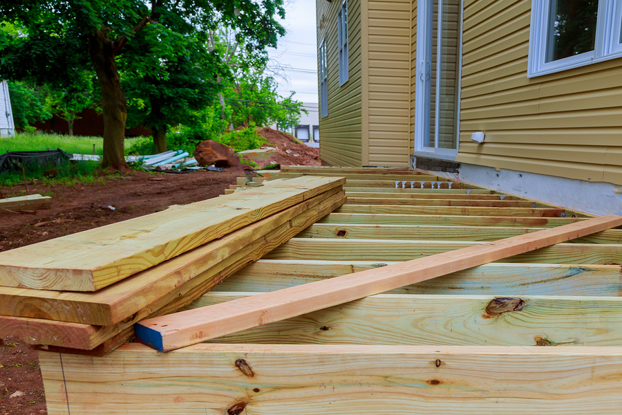 installing wood deck at the side of the house